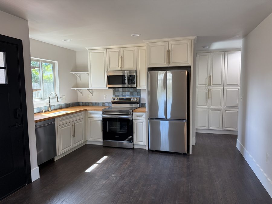Custom ADU interior — finished kitchen with custom cabinetry and premium finishes